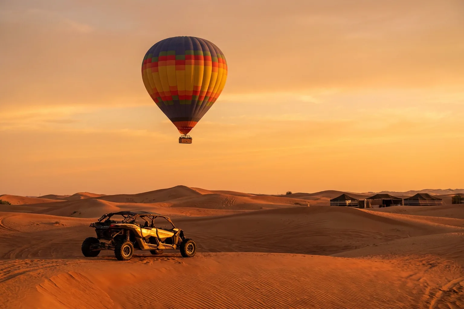 Dubai desert adventure day combining balloon, buggy, and sand experiences